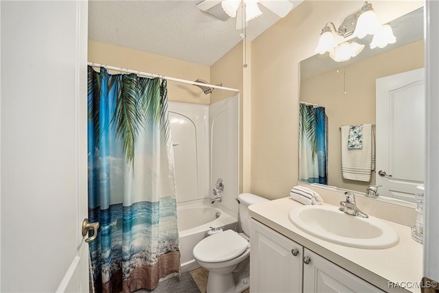 full bathroom with shower / bath combo, vanity, ceiling fan, toilet, and a textured ceiling