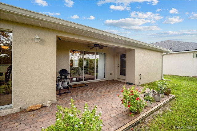 view of patio with ceiling fan and grilling area