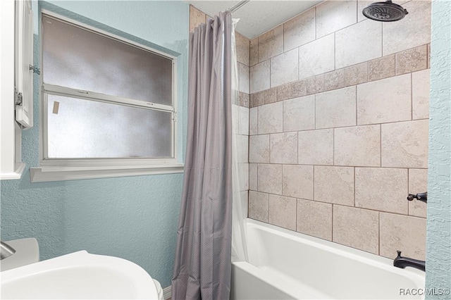 bathroom featuring shower / bath combo and sink