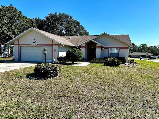 ranch-style home featuring stucco siding, an attached garage, and a front yard