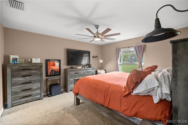 bedroom featuring ceiling fan and carpet floors