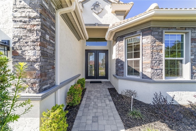 property entrance featuring french doors