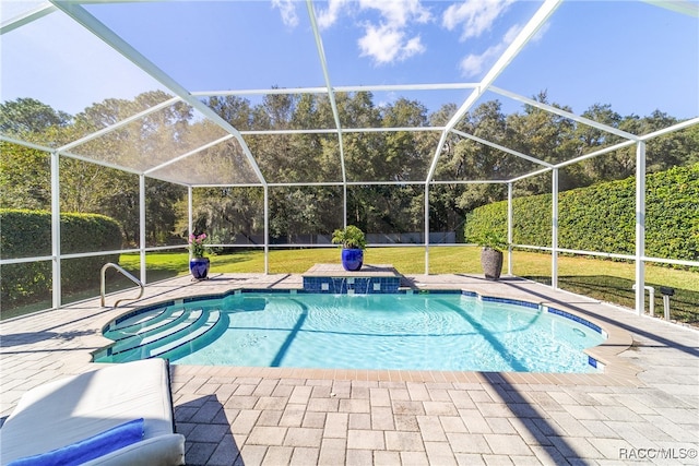 view of pool featuring a yard, pool water feature, and a patio area