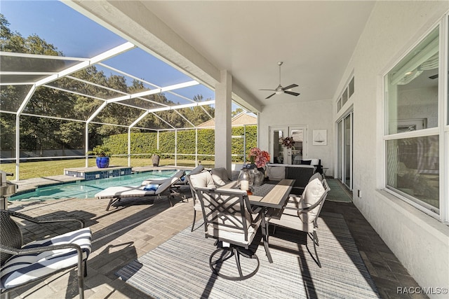 view of patio / terrace with glass enclosure and ceiling fan