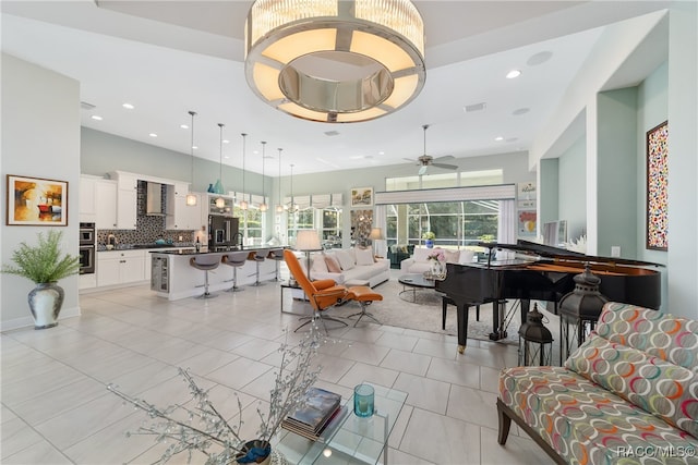 tiled living room featuring ceiling fan