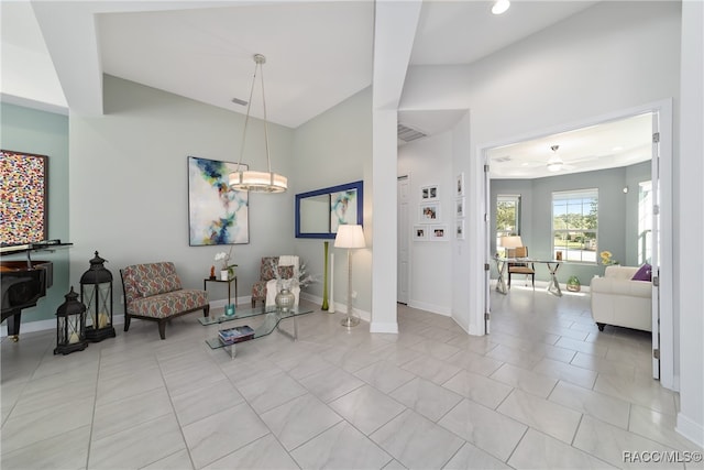 sitting room featuring ceiling fan and light tile patterned floors