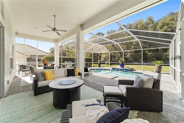 view of patio featuring pool water feature, ceiling fan, a lanai, and an outdoor hangout area