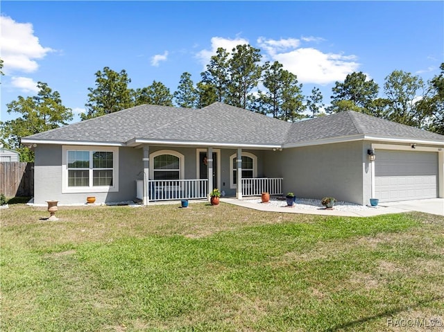 single story home featuring covered porch, an attached garage, fence, a front yard, and stucco siding