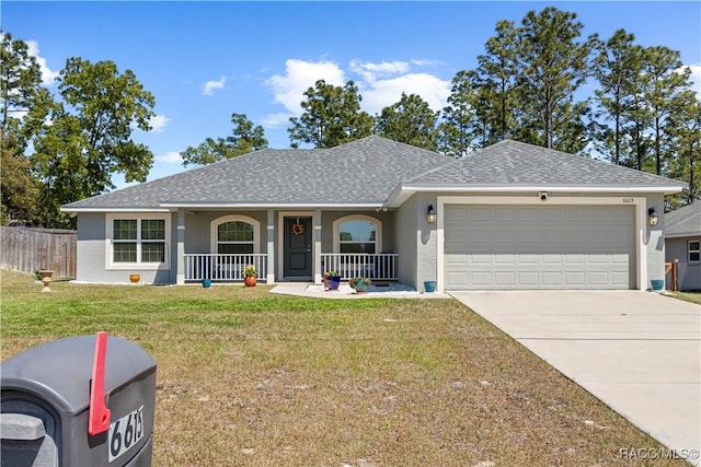 ranch-style home with a front lawn, driveway, covered porch, a garage, and stucco siding