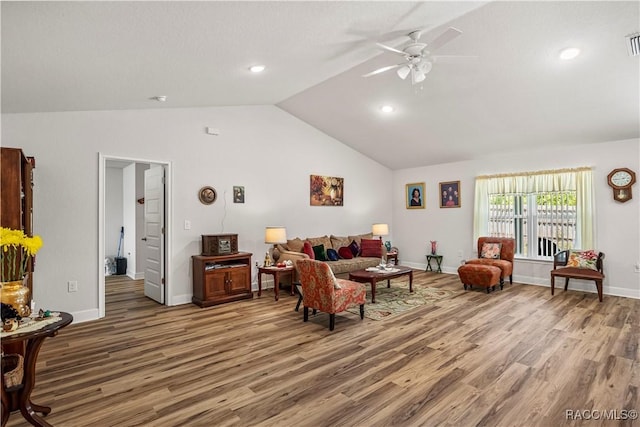 living room with light wood-style flooring, vaulted ceiling, baseboards, visible vents, and ceiling fan