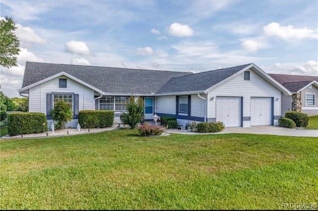 ranch-style house with a garage, driveway, and a front lawn