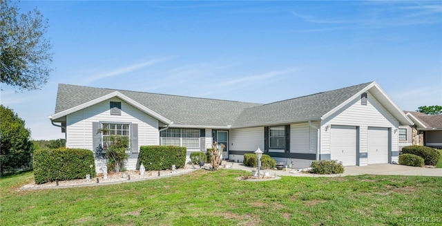 single story home with a garage, concrete driveway, a shingled roof, and a front lawn