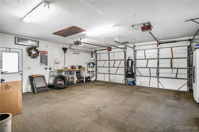 garage featuring electric panel and a garage door opener