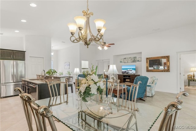 tiled dining area with an inviting chandelier and sink