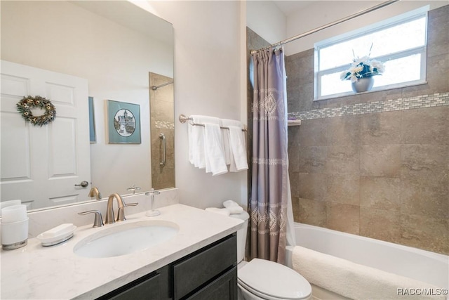 full bathroom featuring vanity, toilet, and shower / tub combo