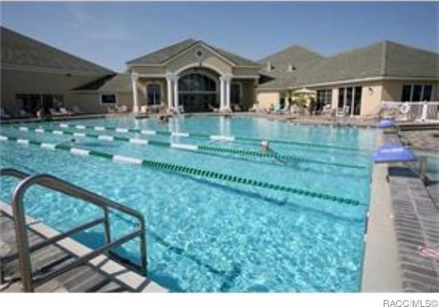 view of pool featuring a patio area