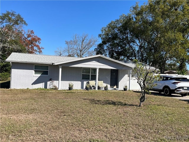 ranch-style house with a front lawn