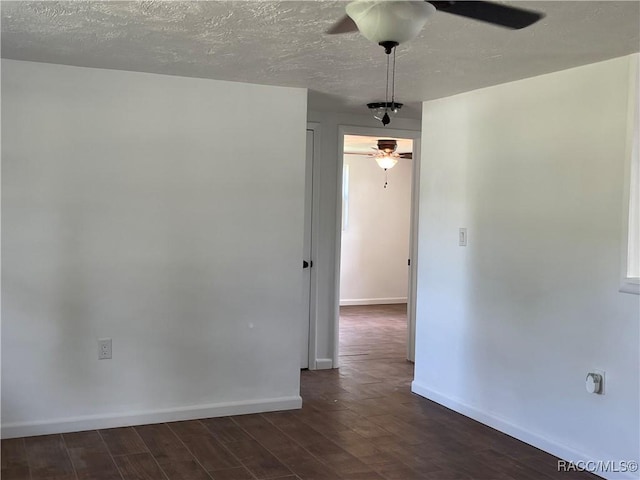 unfurnished room with a textured ceiling and ceiling fan