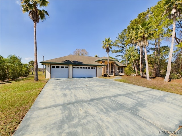 ranch-style house with a garage, driveway, a front yard, and stucco siding