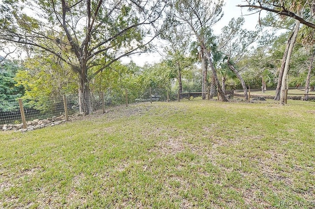 view of yard with fence