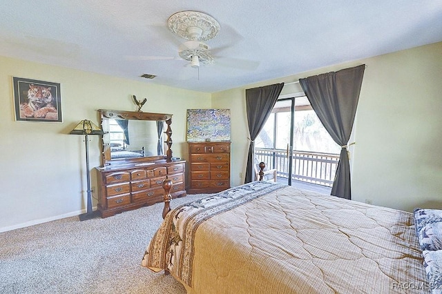 carpeted bedroom featuring a textured ceiling, a ceiling fan, baseboards, visible vents, and access to exterior