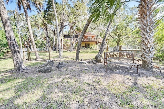 view of yard featuring stairway and a wooden deck