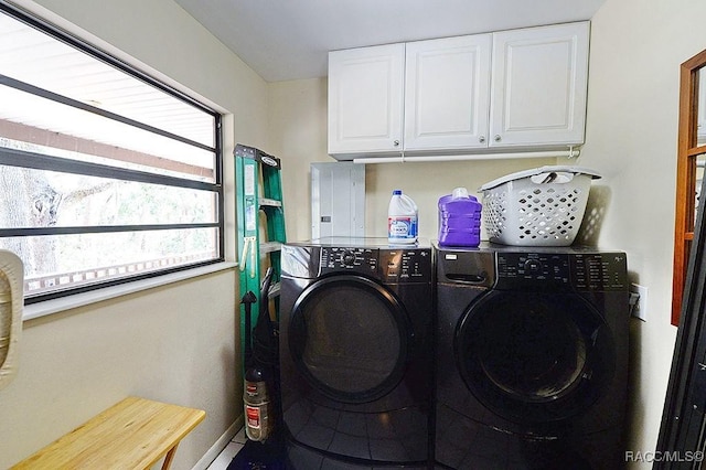 washroom featuring washer and dryer and cabinet space