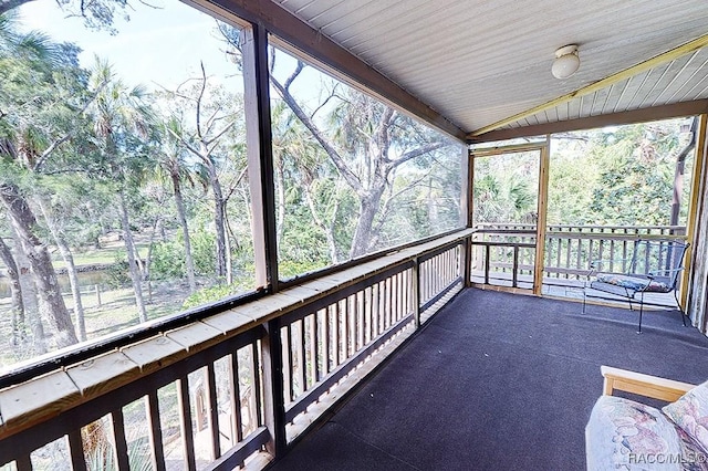 sunroom / solarium with vaulted ceiling