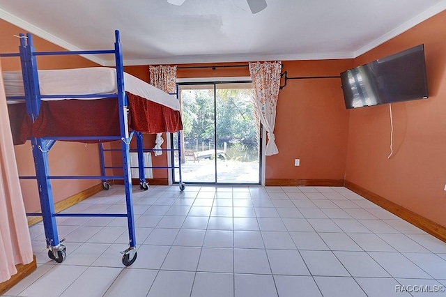 interior space with baseboards and ornamental molding