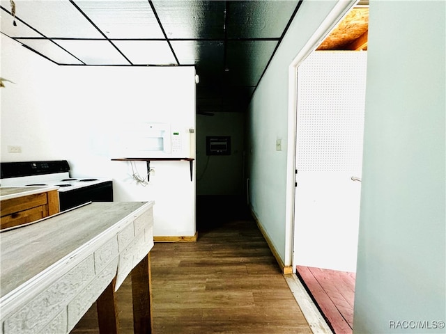 kitchen featuring dark hardwood / wood-style flooring and white appliances