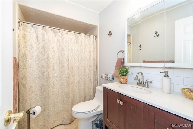 bathroom featuring vanity, backsplash, tile patterned flooring, and toilet