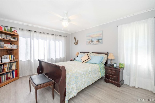 bedroom featuring ceiling fan and light wood-type flooring