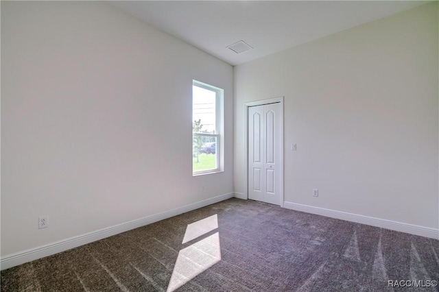 empty room featuring carpet floors