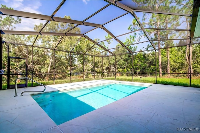 view of pool featuring a patio area and a lanai