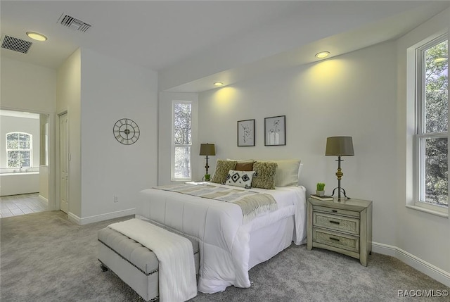 bedroom with light colored carpet