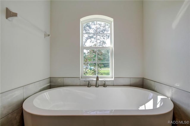 bathroom with a tub