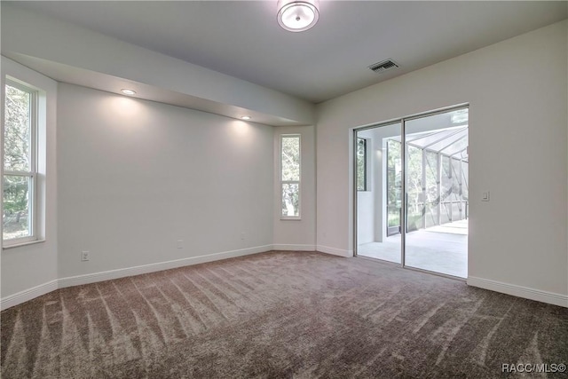 unfurnished room featuring carpet floors