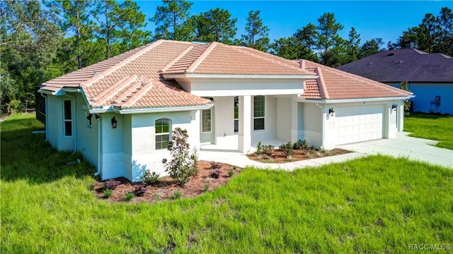 mediterranean / spanish-style home with a garage and a front lawn