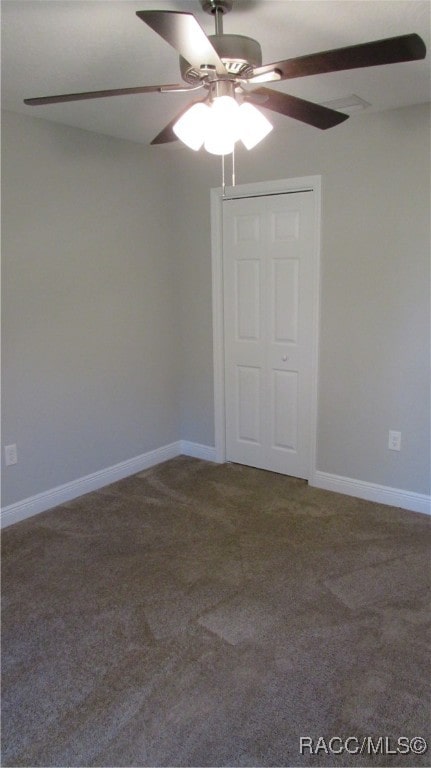 carpeted empty room with ceiling fan