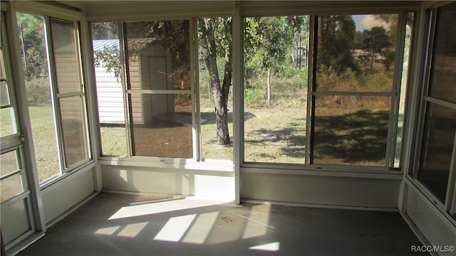 unfurnished sunroom featuring a wealth of natural light