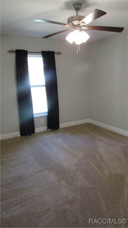 empty room with carpet flooring and ceiling fan