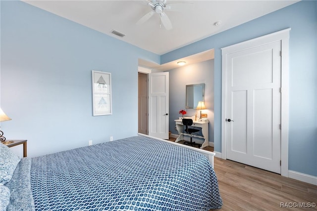 14211 W Saint Martins Rd, Crystal River, FL 34429 - bedroom with visible vents, ceiling fan, wood finished floors, and baseboards