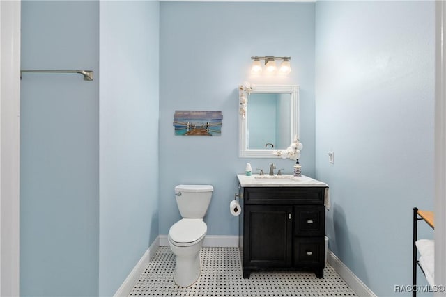 14211 W Saint Martins Rd, Crystal River, FL 34429 - half bathroom with toilet, tile patterned floors, vanity, and baseboards