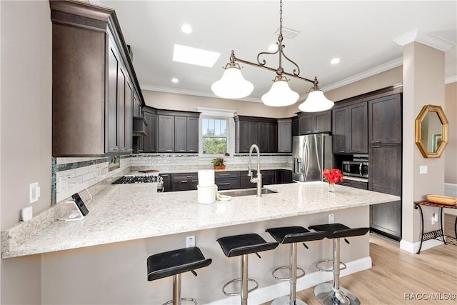 14211 W Saint Martins Rd, Crystal River, FL 34429 - kitchen with a sink, tasteful backsplash, appliances with stainless steel finishes, and a peninsula