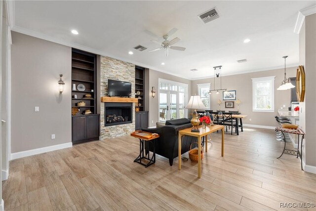 14211 W Saint Martins Rd, Crystal River, FL 34429 - living area featuring light wood-style flooring, visible vents, baseboards, and a ceiling fan
