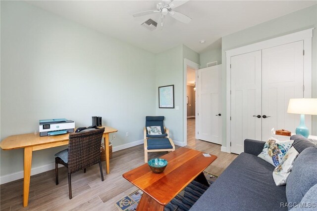 14211 W Saint Martins Rd, Crystal River, FL 34429 - home office featuring visible vents, light wood-type flooring, baseboards, and ceiling fan