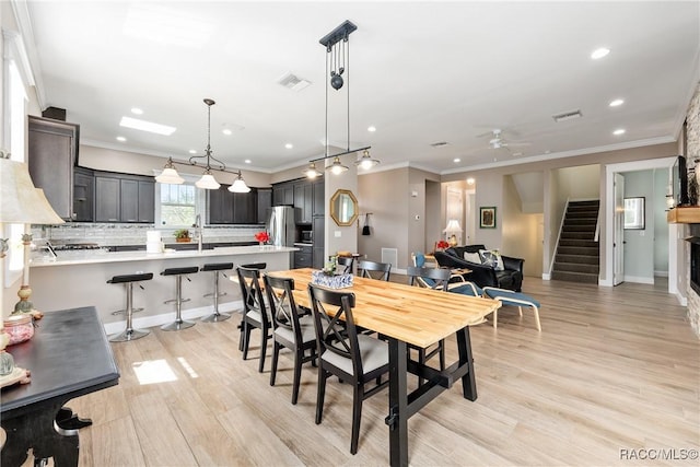 14211 W Saint Martins Rd, Crystal River, FL 34429 - dining space with ornamental molding, stairway, and visible vents