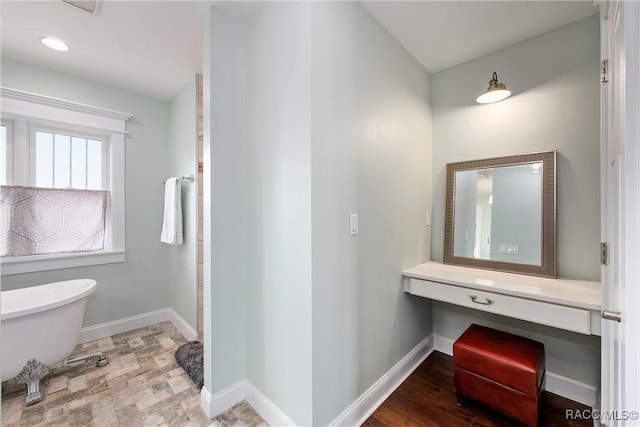 14211 W Saint Martins Rd, Crystal River, FL 34429 - full bath featuring a freestanding bath and baseboards