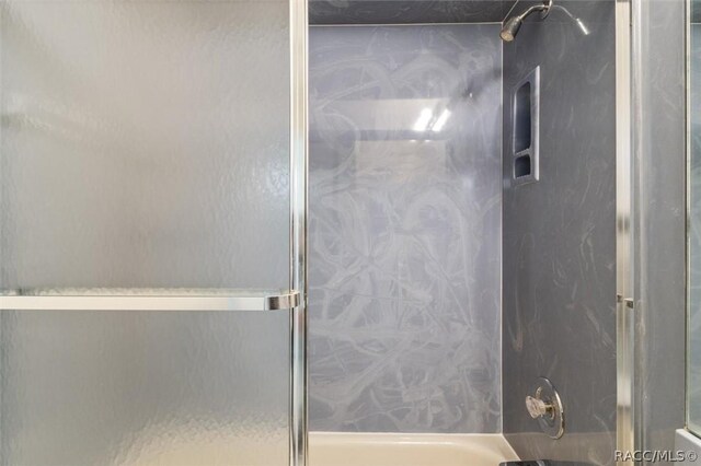 820 Inverie Dr, Inverness, FL 34453 - bathroom featuring enclosed tub / shower combo