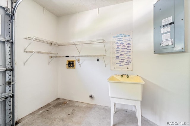 washroom featuring electric panel and hookup for an electric dryer